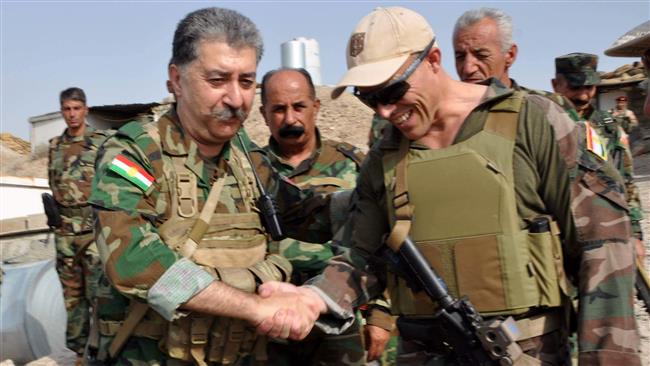 In this picture, posted on Facebook on August 31, 2016, Hussein Yazdanpanah, the leader of the terrorist Kurdistan Freedom Party (PAK), shakes hands with an unidentified individual purported to be a Western military advisor. (Via AP)